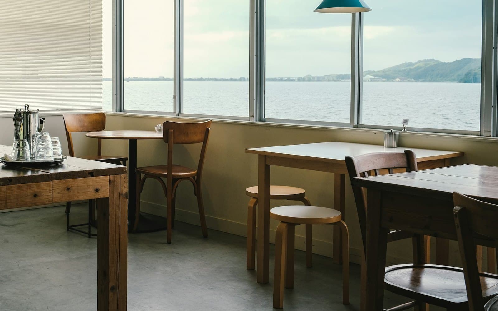 The small dining room at Cafe102, with a handful of tables set for breakfast.